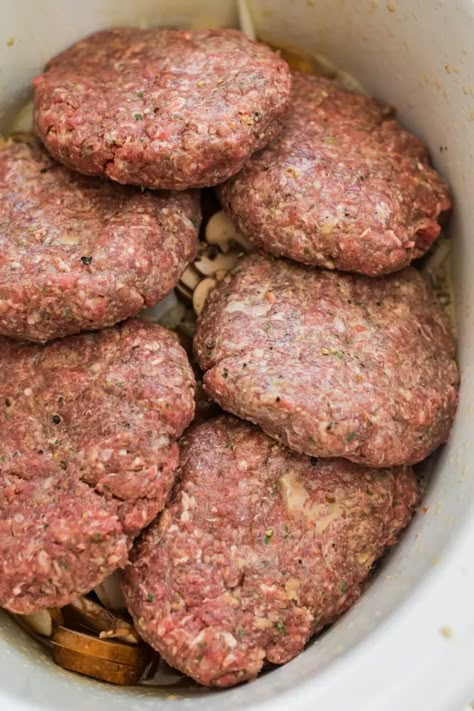 A favorite family meal this easy Salisbury steak recipe is made in the slow cooker making it an easy weeknight dinner Slower Cooker Salisbury Steak, Crockpot Recipes Using Hamburger, Amish Salisbury Steak Recipe, Ground Hamburger Crockpot Recipes, Slow Cooker Hamburger Steaks, Crockpot Salsberry Steaks, Group Crockpot Meals, Hamburgers In Crockpot, Hamburg Crockpot Recipes