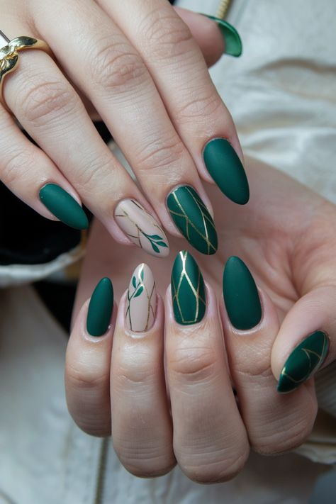 Embrace the essence of autumn with these chic forest green fall nail ideas that effortlessly capture the season's spirit. The deep, earthy tones paired with subtle gold accents create a sophisticated look, perfect for cozy gatherings and crisp days. These nails will have everyone asking for your secret! Get ready to showcase your style as you step into fall full of confidence. January Nails Green, Woodland Nail Art, Green And Tan Nails, Forest Green And Gold Nails, Green Accent Nails, Forest Green Nail Ideas, Ireland Nails, Autumn Nails Green, Green Autumn Nails