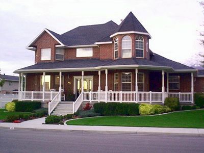 Brick colonial with a wrap around porch :-) Brick Colonial House, House Wrap Around Porch, House With Wrap Around Porch, Homes With Wrap Around Porches, Wrap Around Porches, Brick Porch, Georgia House, Awesome Houses, Lake Ideas