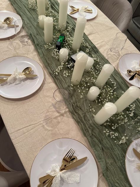 Flatlay image of dinner party for friendsgiving with pillar candles and green Dinner Decoration Ideas Table At Home, Green Dinner Table Decor, Dining Table Party Decor, Iftar Dinner Table, Simple Dinner Decor, Green White Party Decorations, Birthday Color Theme Ideas, Dinner Table Decor With Candles, Decoration For Dinner Table