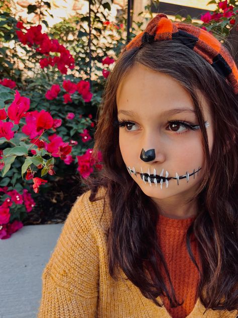 Skeleton makeup with fall outfit and flowers. Skeleton Dress Up Ideas, Face Paint Skeleton Easy, Easy Face Painting Ideas For Halloween, Cute Skeleton Face Paint, Toddler Halloween Face Paint, Skeleton Face Paint Easy Kids, Skeleton Kids Makeup, Baby Skeleton Makeup, Simple Skeleton Face Paint