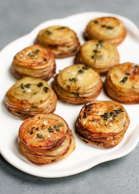 Crispy Potato Stacks with Garlic Herb Butter — saltnpepperhere Veggie Tapas, Salt And Pepper Potatoes, Potato Stack, Appetizer Potatoes, Potato Stackers Recipe, Potatoes In Muffin Tin, Thanksgiving Sides Potatoes, Stacked Potatoes In Muffin Tin, Stacked Potatoes