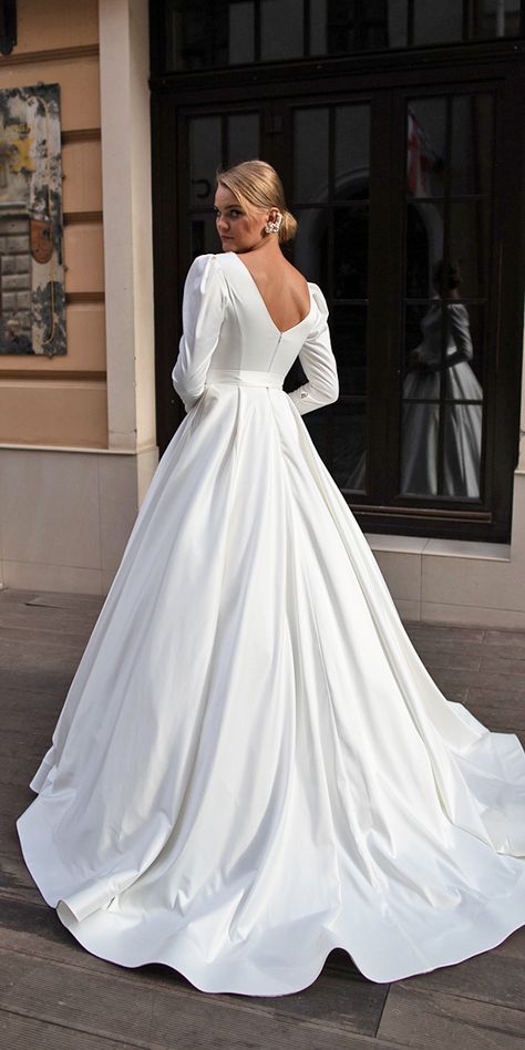 27 Of The Most Graceful Simple Wedding Dresses With Sleeves | Wedding Dresses Guide Simple Wedding Dresses With Sleeves, Long Sleeve Satin Wedding Dress, Simple Wedding Dress With Sleeves, Puffy Wedding Dresses, Rustic Wedding Gowns, Simple Wedding Dresses, Celebrity Wedding Dresses, Wedding Dress Guide, Back Wedding Dress