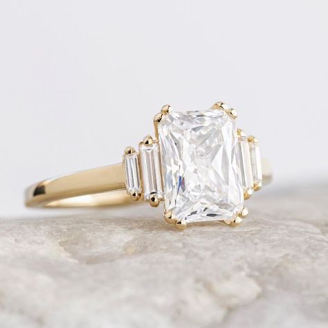 Laura Preshong ~ Wedding Rings on Instagram: "Beautiful Kinsley, customized with double prongs. 😻 Set with an approximate 2 carat Radiant Cut center stone in recycled 14k yellow gold. Do you love it?! Tell us below👇" 3 Carat Radiant Engagement Ring, French Woman Style, Five Stone Engagement Ring, Ring Types, Engagement Ring Baguette, Baguette Cut Ring, Engagement Ring Types, Radiant Cut Diamond Ring, Emerald Cut Ring