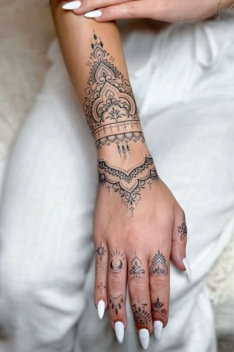 The ornamental hand tattoo is an elegant tattoo idea for women who want something intricate and artistic. This small tattoo for female hands adds a decorative touch, perfect for those who love detailed and graceful designs. Henna Arm Tattoo, Best Female Tattoos, Wrist Tats, Tattoos On Hand, Mandala Arm Tattoos, Mandala Tattoos For Women, Mandala Wrist Tattoo, Butterfly Tattoos On Arm, Full Hand Tattoo