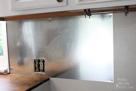 Install Your Own Magnetic Metallic Backsplash, this is inexpensive and should be really easy to clean. Sheet Metal Backsplash, Metal Backsplash, Paint Backsplash, Backsplash Wallpaper, Stainless Steel Backsplash, Steel Backsplash, Farmhouse Backsplash, Unique Backsplash, Beadboard Backsplash