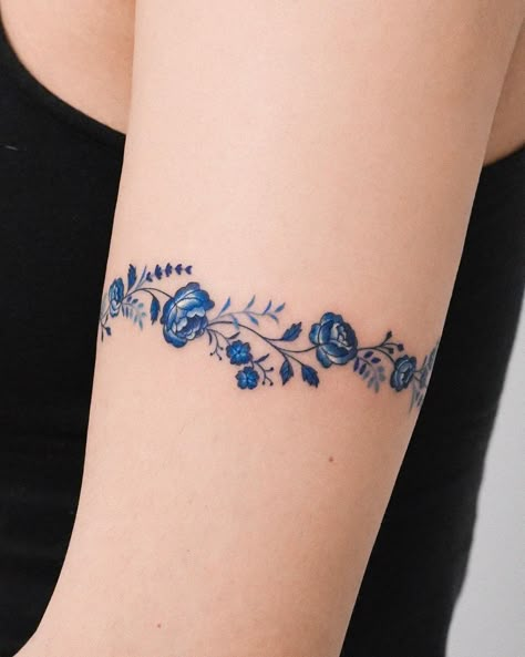 Roses are timeless tattoo motifs. They might vary in color, style, design and meaning, but year after year they remain a solid choice for a variety of... I have butterfly tattoo for you https://shambhusah.gumroad.com/l/Butterfly-tattoo Blue Bracelet Tattoo, Sapphire Tattoo Ideas, Upper Arm Bracelet Tattoo, Blue Tattoos For Women, Blue Roses Tattoo, Sapphire Tattoo, Blue Rose Tattoo Meaning, Blue Ink Tattoo, Braclet Tattoo