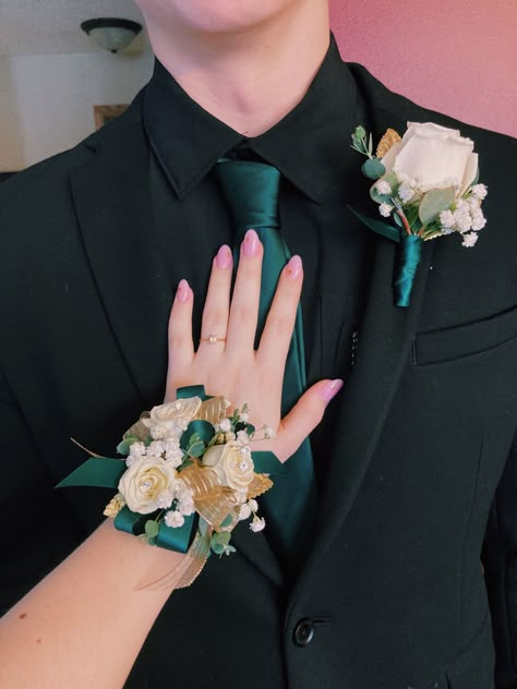 Black Tux With Green Vest, White And Green Corsage And Boutonniere, Green Prom Boutonniere, Quince Chambelanes Outfits Green, Dark Grey Suit With Emerald Green Tie, All Black Suit With Dark Green Tie, Corsages For Green Dress, Black Tuxedo With Green Tie, Corsages And Boutonnieres Homecoming