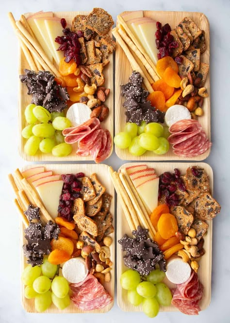 Charcuterie boards are a fun addition to any gathering, but sometimes mini charcuterie boards make more sense than a larger display. Small charcuterie boards are great for events where you want everyone to grab something quickly and mingle, for a movie night where you want everyone to get an even mix of the foods, or for an event where you just want to portion everything out ahead of time. #charcuterie #snacks #entertaining #easyrecipe #mini