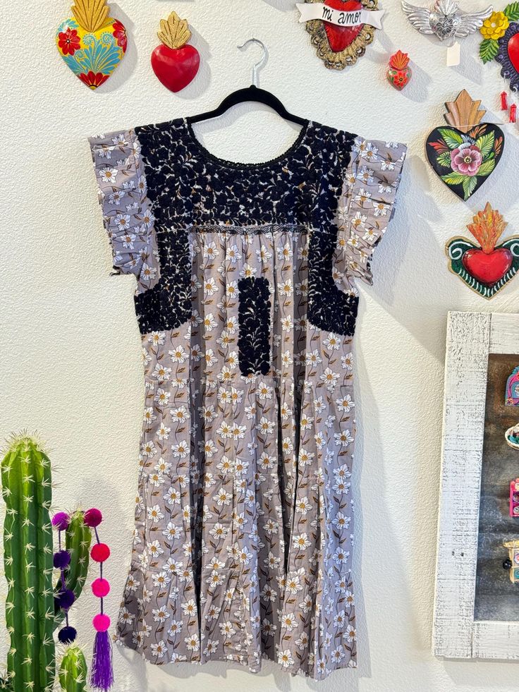 Our San Antonino dresses are unique, beautiful and perfect for any fiesta, a day at the beach or a formal event. You can easily dress it up or dress it down. Our dresses are completely hand embroidered by Artisans in Oaxaca, Mexico. It takes approximately 1 month to complete one dress.  Our San Antonino dresses are one of a kind. You will fall in love with every single detail. Each dress is hand embroidered on front chest area, sides and back with tiny floral designs inspired by the flowers in the region using beautiful color combinations. Crochet on sleeve and neckline. Across the chest, it has the "Hazme Si Puedes" (Make Me if You Can) technique, distinctive to their community. This intricate crochet technique shows tiny men and women lined together holding hands.  Fabric & thread are 10 Floral Print Flutter Sleeve Sundress, Floral Print Sundress With Flutter Sleeves, Floral Print Dress With Flutter Sleeves For Brunch, Bohemian Midi Dress With Flutter Sleeves For Garden Party, Party Dress With Flutter Sleeves And Lace Trim, Flowy Knee-length Dress With Lace Trim, Lace Patchwork Sundress, Garden Party Dress With Lace Trim And Ruffle Sleeves, Bohemian Flutter Sleeve Dress For Garden Party