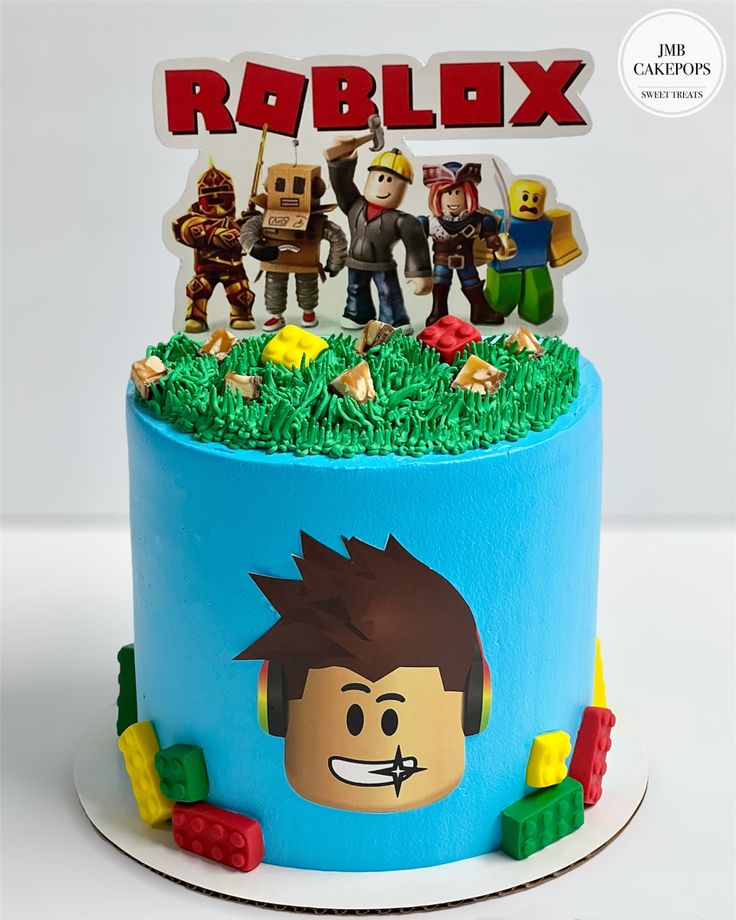 a lego movie themed birthday cake with the name roblox and characters on it