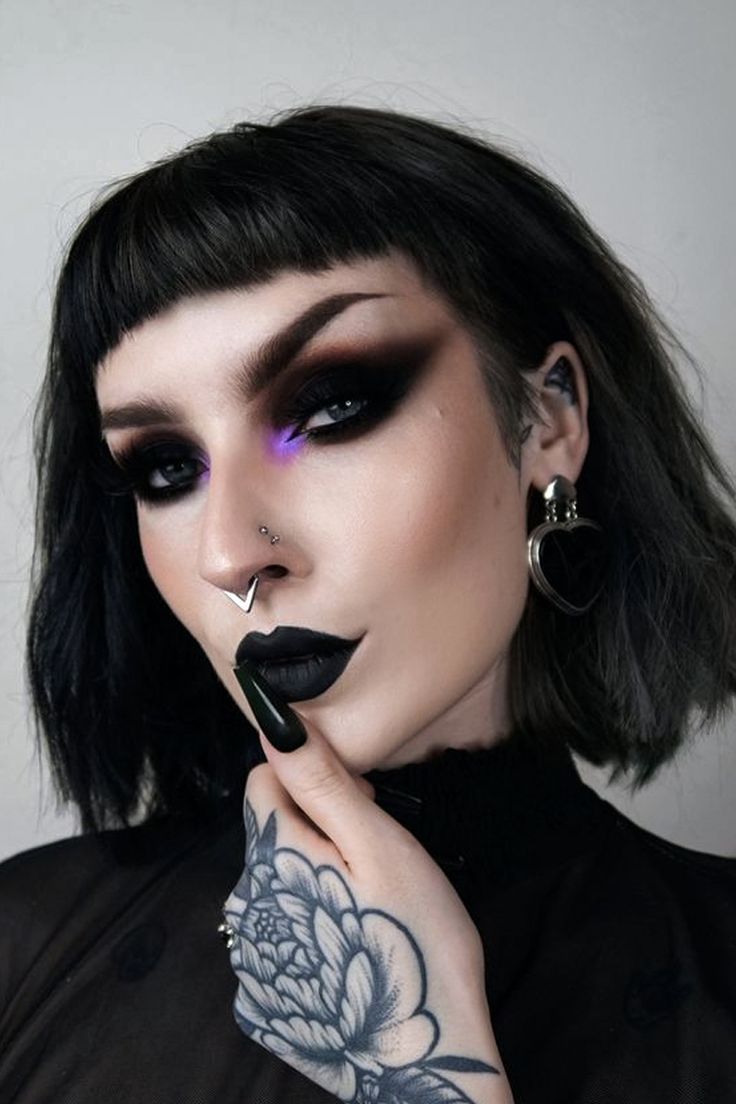 A young goth woman with dramatic gothic makeup look and hair is posing for the camera Goth Aesthetic Makeup, Maquillage Goth, Goth Makeup Looks, Goth Makeup Tutorial, Goth Eye Makeup, Look 80s, Bluish Green Eyes, Gothic Ideas, Witch Makeup