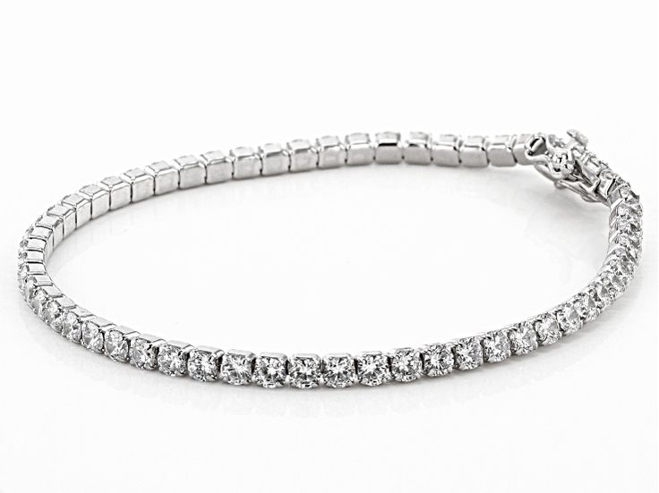 Pre-Owned Bella Luce ® white diamond simulant 9.58ctw round, rhodium over sterling silver bracelet. Measures approximately 7 1/4"L x 1/8"W and has a hidden box closure. The diamond equivalent weight is 6.16ctw..  This product may be a customer return, vendor sample, or on-air display and is not in its originally manufactured condition.  It may not be new.  In some instances, these items are repackaged by JTV. Classic White Gold Diamond Bracelet With Pave Setting, Platinum Tennis Bracelet With Pave Setting For Formal Occasions, Formal Bracelet With Prong Setting, White Gold Tennis Bracelet With Diamond Accents, Formal Platinum Tennis Bracelet With Pave Setting, Formal Platinum Pave Setting Tennis Bracelet, Sterling Silver Bracelet With Sparkling Stones, Formal Diamond Bracelet With Sparkling Round Cut Stones, Dazzling White Gold Bracelet With Prong Setting