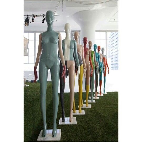 there are many mannequins standing in the room