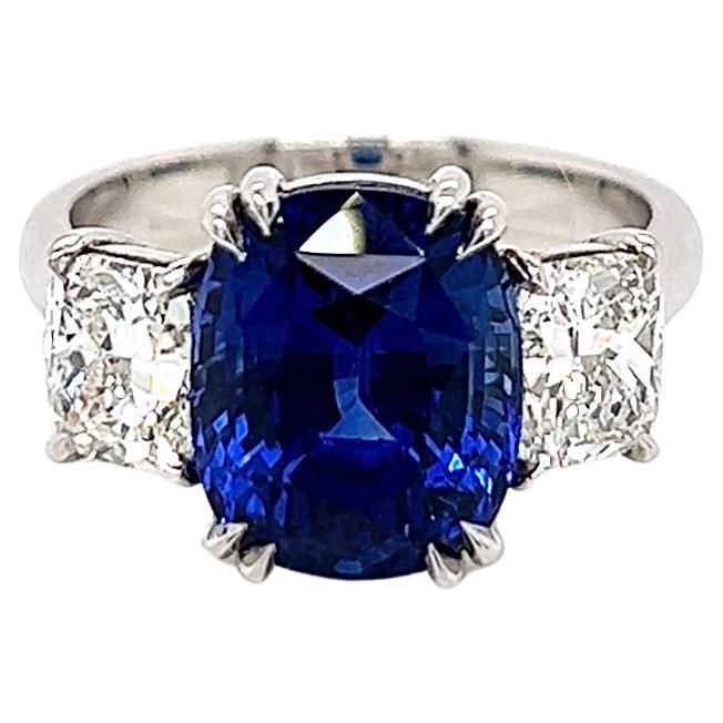 7.87 Total Carat Sapphire and Diamond Ladies Ring. GIA Certified. -Metal Type: Platinum -6.27 Carat Cushion Cut Natural Blue Sapphire, GIA Certified -Sapphire Measurements: 10.62 x 8.77 x 7.45 mm -0.80 Carat Cushion Cut Natural side Diamond. GIA Certified (Report: 2155461561). H Color, VS1 Clarity -0.80 Carat Cushion Cut Natural side Diamond. GIA Certified (Report: 2155461646). H Color, VS2 Clarity -Size 6.5 Made in New York City. Luxury Blue Sapphire Ring As Gift, Luxury Fine Jewelry Sapphire Ring As Gift, Luxury Gia Certified Sapphire Jewelry, Cocktail Ring Designs, Cushion Ring, Ladies Ring, Sapphire Diamond Ring, Natural Blue Sapphire, Sapphire Diamond