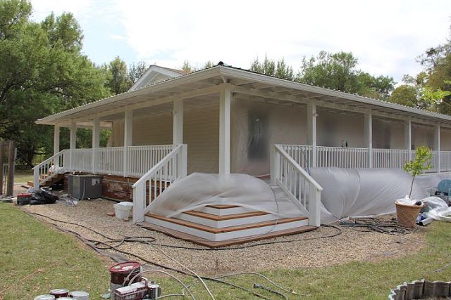 a house that is under construction and covered in plastic