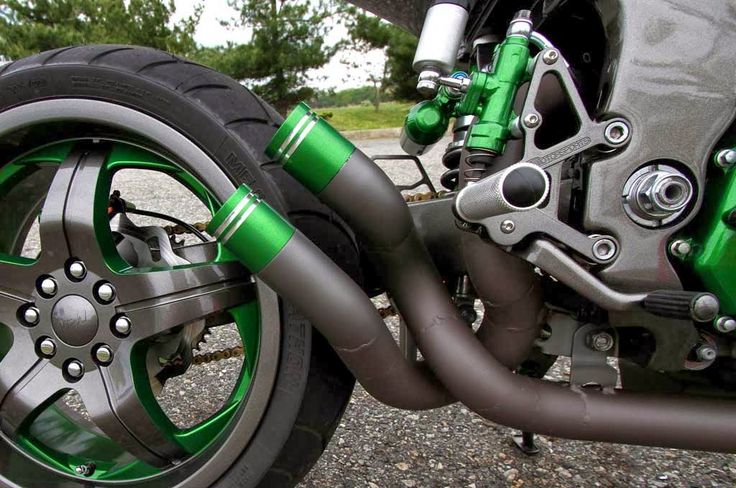 the front wheel of a motorcycle with green accents