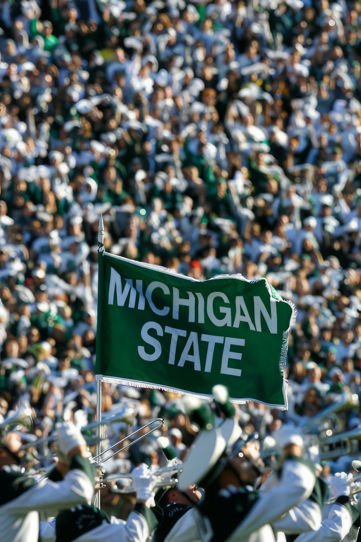 the michigan state marching team is performing in front of an audience