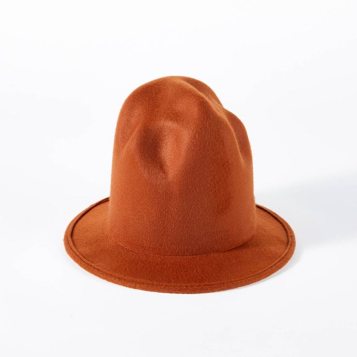 a brown hat sitting on top of a white table