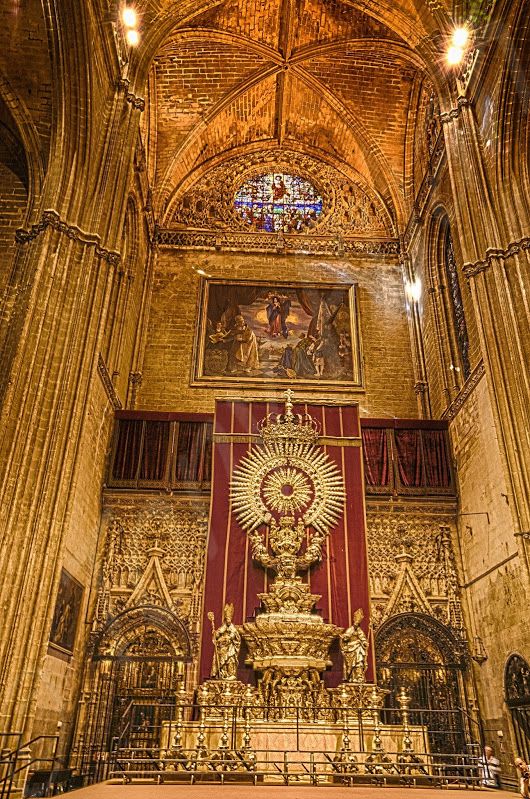 the inside of a church with an ornate alter