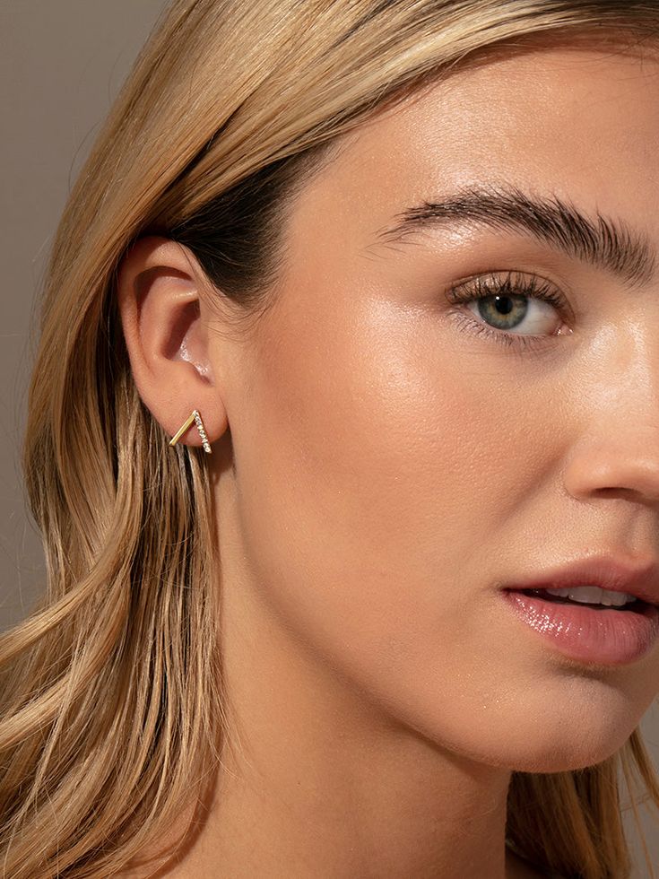 We took our best-selling Little Stud Earrings and made them even more minimal to create your new favorite — the Little Stud 2.0 Earrings. These gold stud earrings feature an upside down V shape with one solid side and one side of pavé. Add these gold pavé earrings to your collection for an everyday stacking staple. | Gold Little Stud 2.0 Pavé Earrings | Women's Jewelry by Uncommon James Minimal Earrings Gold, Gold Studs Earrings Indian, Earrings Studs Gold, Gold Studs Earrings, Small Earrings Gold, Uncommon James, Casual Indian Fashion, Minimal Earrings, Earrings Indian