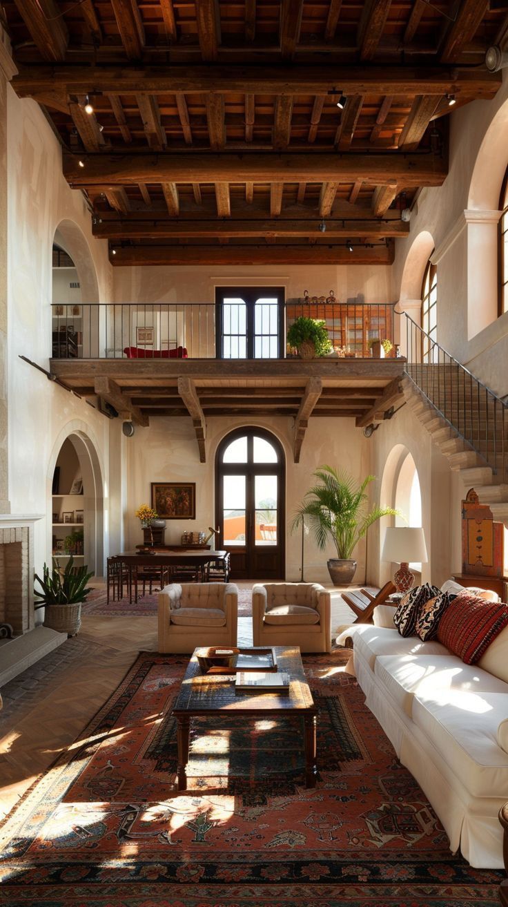 a living room filled with lots of furniture next to a fire place in a building