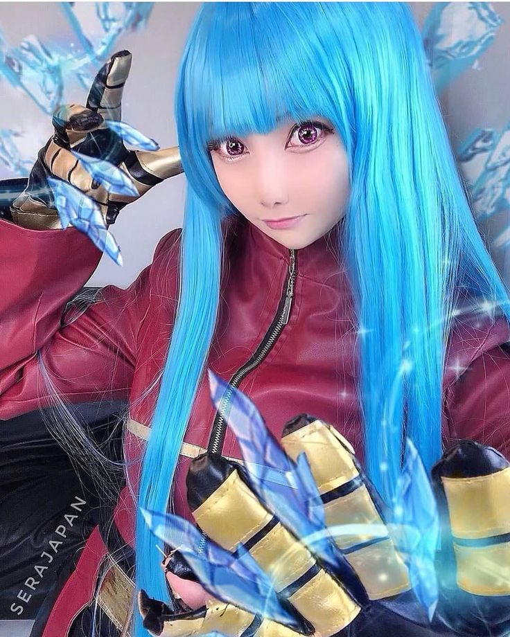 a woman with long blue hair and gloves