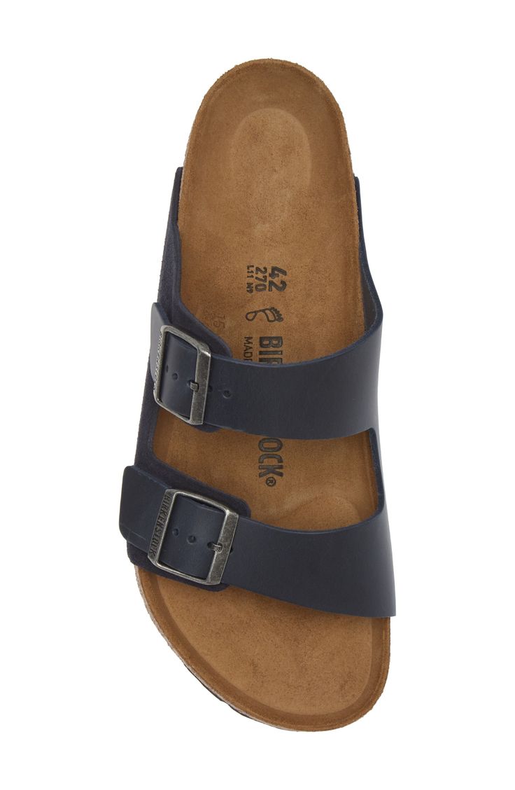 A leather slide sandal is made with Birkenstock's legendary footbed that mimics the shape of your foot and provides excellent support. Support: enhances the fit with targeted contouring and cushioning in the footbed Cushioning: absorbs impact and distributes weight for consistent, buoyant comfort under each step Contoured footbed with arch support Leather upper and lining/synthetic sole Made in Germany Classic Adjustable Slides With Leather Footbed, Classic Slide Sandals With Cushioned Footbed, Classic Slide Footbed Sandals With Cushioned Footbed, Classic Cushioned Slide Footbed Sandals, Classic Comfort Slip-on Footbed Sandals, Classic Cushioned Footbed Slip-on Sandals, Classic Cushioned Slip-on Footbed Sandals, Classic Slides With Cushioned Footbed And Single Toe Strap, Comfortable Leather Footbed Sandals With Arch Support