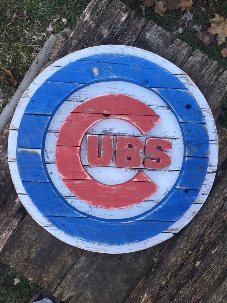 a wooden sign with the chicago cubs on it