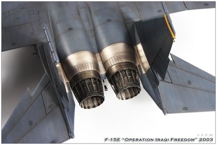 two jet engines are attached to the side of a fighter plane's engine compartment