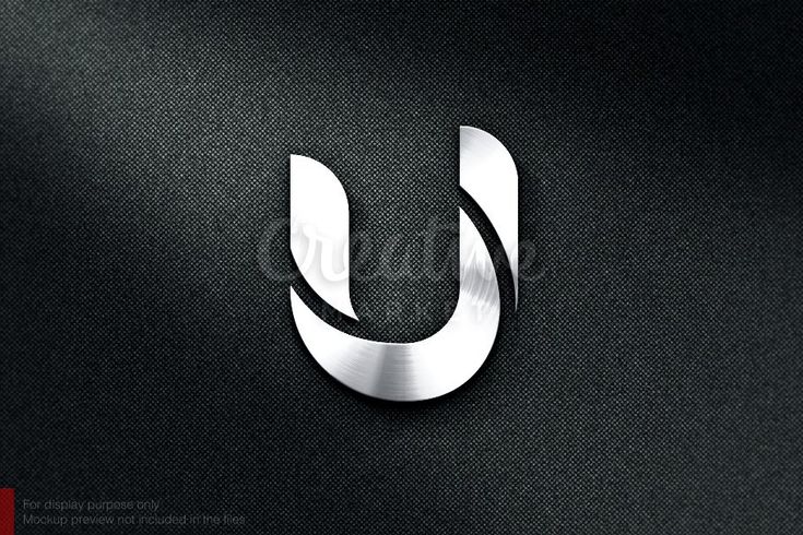 the letter u made out of metal on a black background