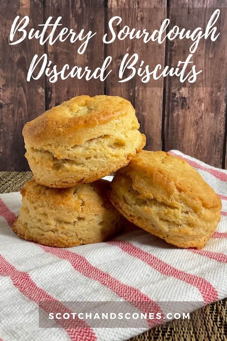 three buttery sourdough biscuits stacked on top of each other