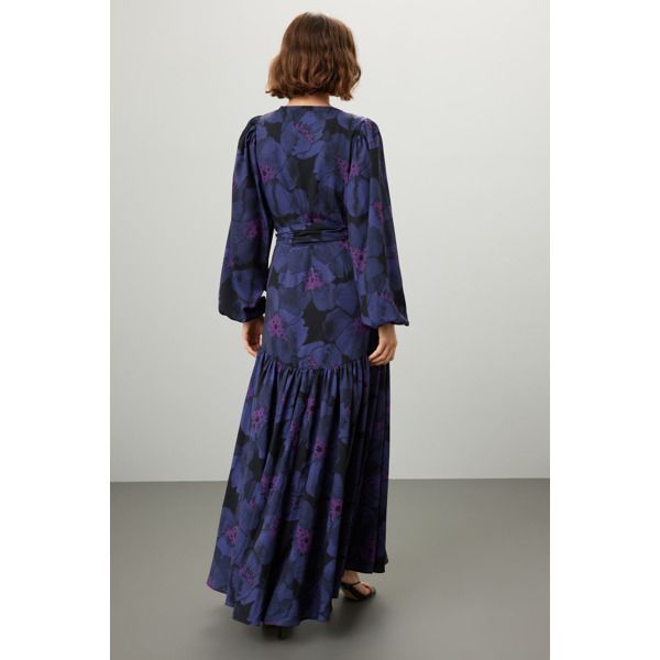 Purple floral crepe (100% Polyester). A-line. Long sleeves. V-neck. Tie closure. 58" from shoulder to hemline. Imported. Printed V-neck Evening Dress, Elegant Printed V-neck Floral Dress, Printed V-neck Midi Dress For Daywear, V-neck Printed Midi Dress For Daywear, Flowy V-neck Floral Dress For Fall, Fall A-line Maxi Dress For Brunch, Chic V-neck Floral Dress For Fall, Formal Printed V-neck Dress, Formal V-neck Viscose Maxi Dress