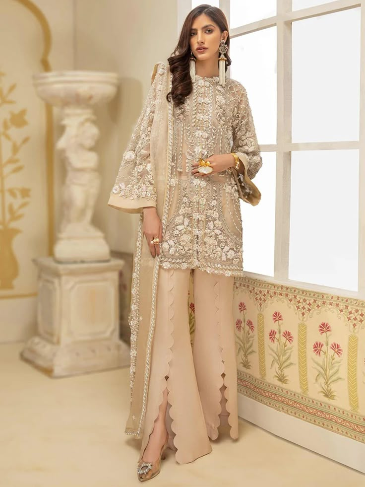 Brand : Basit Sipra Product Details : Hand Embellishments Shirt Front 3D work (Organza) Embroidered Shirt Back (Organza) Hand Embellishments Dupatta (Organza) Dyed Raw Silk Trouser This is a 3 piece unstitched & Stitched outfit Replicate Designs  by Libaas Khaas Beige Embroidered Palazzo Set For Wedding, Embroidered Beige Palazzo Set For Wedding, Beige Zari Wedding Dress, Beige Zari Work Wedding Dress, Elegant Georgette Dupatta For Ceremony, Beige Embroidered Sets For Wedding, Beige Dress With Dabka Work For Reception, Beige Wedding Dress With Zari Work, Beige Embroidered Wedding Sets