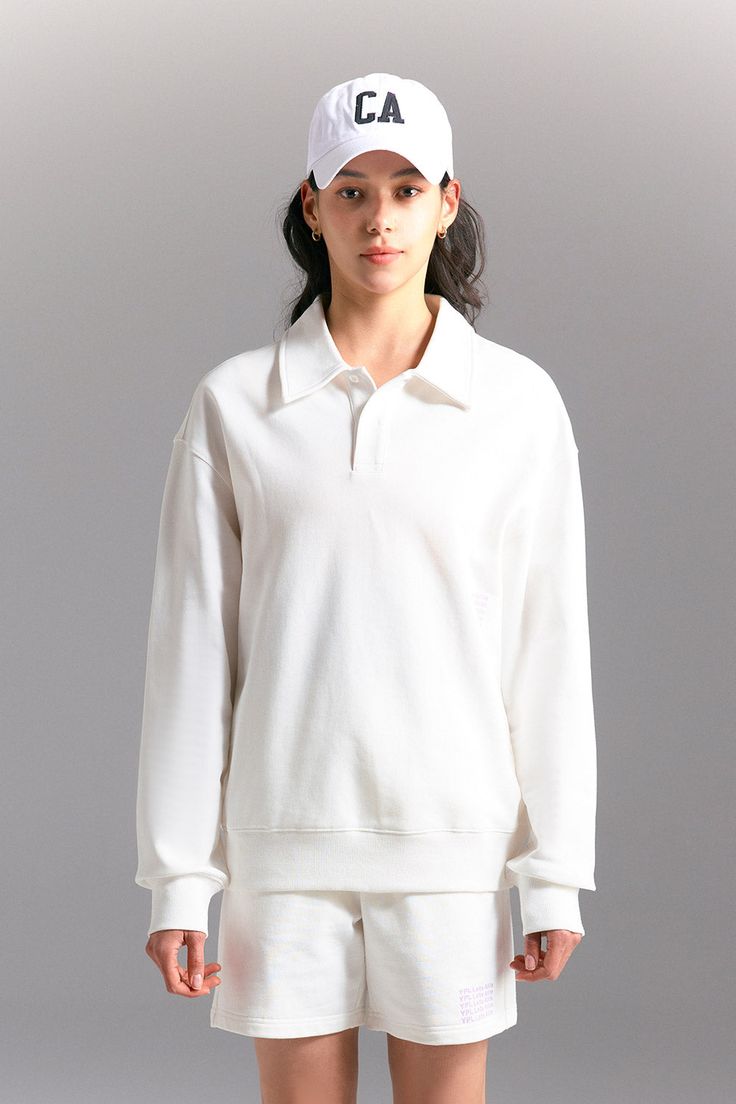 This pullover gets an A+ for versatility. Made from the same super-soft cotton, this chill yet preppy look features dropped shoulders, polo collar styling and a wear-everywhere, full length. We love it with cozy shorts and slides. Collar Sweatshirt, Polo Pullover, Athleisure Women, Collared Sweatshirt, Preppy Look, White Polo, Yoga Set, Polo Collar, Sweater Coats