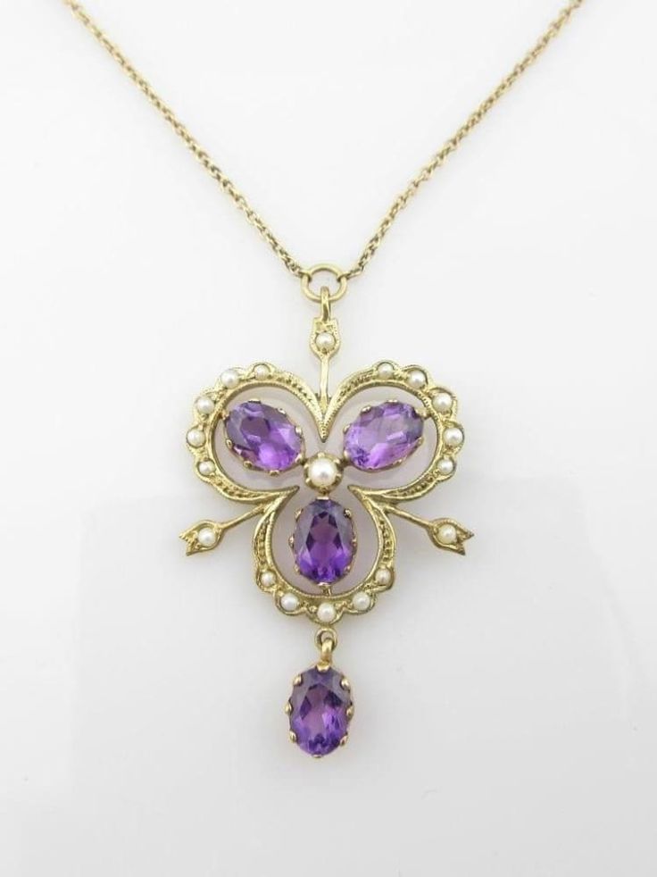 This 9ct gold necklace is so beautifully designed & has such style I'm not sure where to start. In the necklace are four oval cut 7x5mm beautiful deep purple amethysts (total weight approx 3ct) and 19 little genuine pearls. The center focal point is a lovely clover like amethyst with the drop which really stands out nicely.  A truly lovely combination, well designed necklace that measures (pendant =4.4x2.5cm) and the chain measures  46cm long and can be made shorter by 3cm - self adjustable.  Th Oval Purple Necklace For Anniversary, Purple Oval Necklace For Anniversary, Purple Oval Necklaces For Anniversary, Purple Necklaces For Anniversary, Purple Necklace For Anniversary With Hallmark, Purple Oval Pendant Necklace For Anniversary, Purple Hallmarked Necklaces For Anniversary, Formal Purple Pendant Necklace, Victorian Purple Necklace For Anniversary