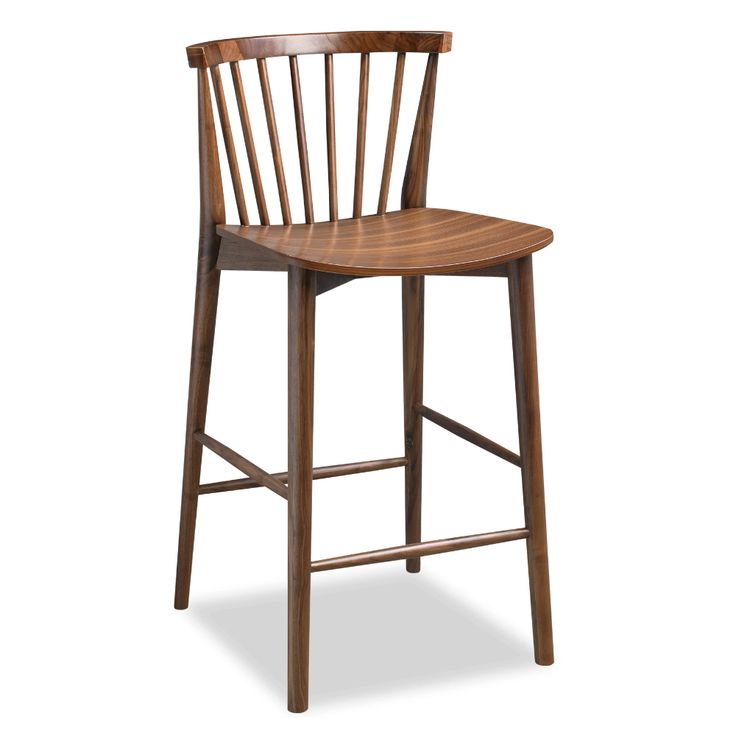 a wooden bar stool with a bent back and slatted seat on an isolated white background