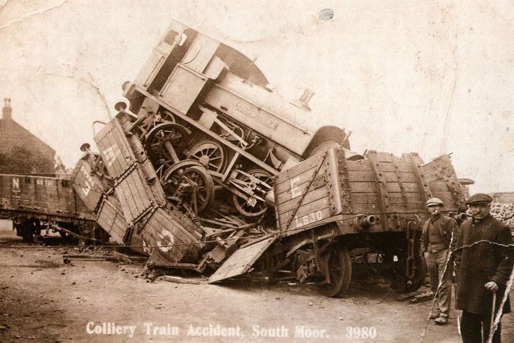 an old black and white photo shows men standing next to a truck that has been loaded with equipment