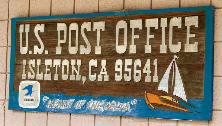 a sign on the side of a building that says u s post office islington ca