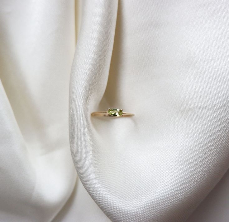 14k Gold Peridot Ring, 14k Gold Marquise Peridot Ring, 14k Minimalist Peridot Ring, 14k Stacking Peridot Ring 14k Gold Marquise Peridot Ring ✦ Product Features: ● Made to order ● Materials: Solid Gold ● Gold Kt: 9K, 10K, 14K, 18K ● Gold color: Rose Gold, White Gold, and Yellow Gold ● Setting: Natural Peridot ● Total number of stones: 1 ● Total Peridot ctw: 0.23 ctw ● Band width: 1.10mm ● Ready to ship: 7-10 business working days (excluding weekends) ✦ Gemstone Certificate: ● Absolutely, if you w Formal Peridot Birthstone Ring For May, Peridot Birthstone Diamond Ring Fine Jewelry, Green Round Cut Birthstone Ring In 14k Gold, Yellow Gold Peridot Stackable Rings For Wedding, Green 14k Gold Round Cut Birthstone Ring, Green 14k Gold Birthstone Ring With Round Cut, Fine Jewelry Peridot Birthstone Ring In Round Cut, Fine Jewelry Peridot Birthstone Ring Round Cut, Green Gemstone Stackable Rings In 14k Gold