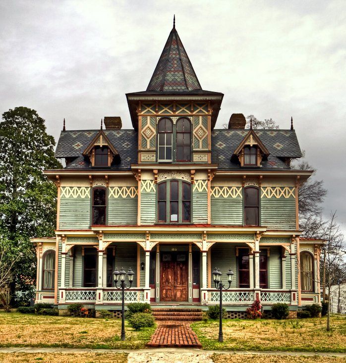 an old victorian style house with a tower