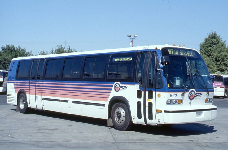 a white bus parked in a parking lot