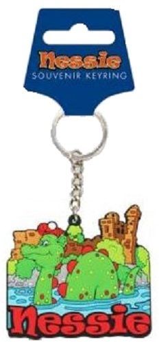 a plastic keychain with an image of a dinosaur and castle in the background