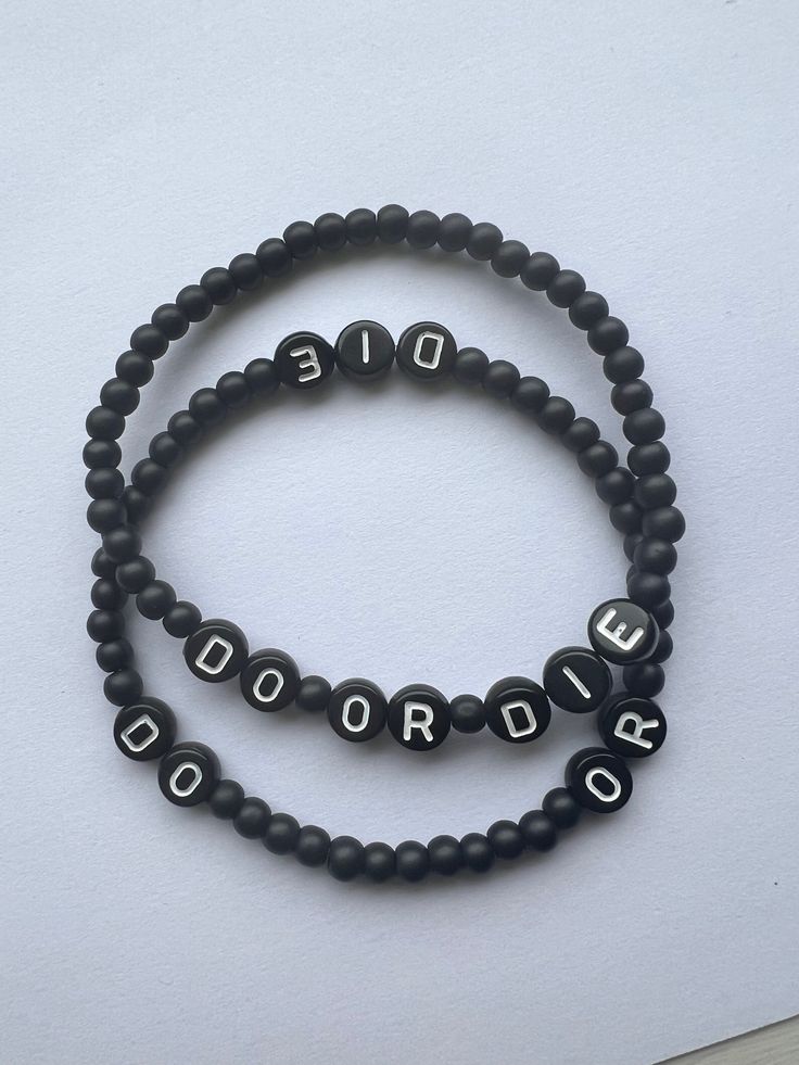 Do or Die stretch bead bracelet made with black matte glass beads and acrylic letters 2 style choices: 1. Words close together  2. Words spaced out Trendy Black Jewelry With Letter Print, Trendy Stretch Bracelet With Letter Print And Round Beads, Trendy Stretch Bracelet With Letter Print Beads, Trendy Black Name Bracelet With Round Beads, Trendy Black Beaded Name Bracelet, Black Beaded Bracelet With Letter Print As Gift, Black Beaded Bracelets With Letter Print As Gift, Trendy Personalized Black Bracelet, Casual Black Name Bracelet