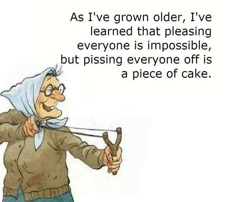 an old woman holding a piece of cake in one hand and pointing at it with the other