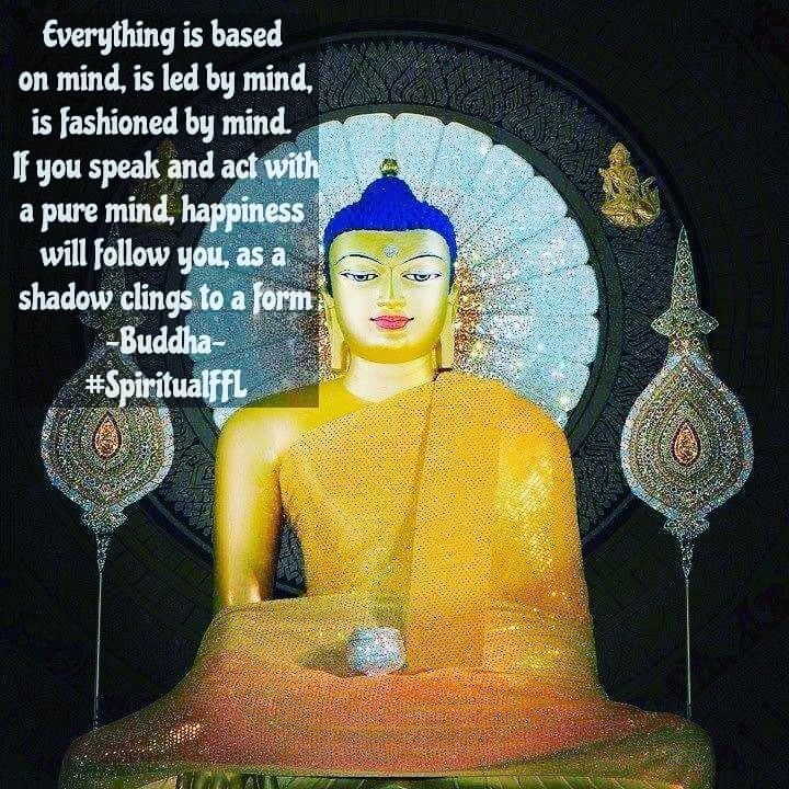 there is a buddha statue with a quote on it