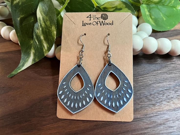 The perfect pair of beautiful yet neutral earrings that complement any outfit -- dressy or casual. You will never tire of wearing these lightweight and stunningly engraved, hand painted wooden earrings. A wonderful and thoughtful birthday, Christmas or 5th anniversary gift. These trendy, lightweight, wooden earrings are the perfect addition to any outfit whether dressy or casual. The wood adds a natural touch while the dangle design has a stylish look. These earrings are made with stainless steel hypo-allergenic hooks. FREE SHIPPING on orders totaling $35 or more. Looking for another set of earrings or gift to fall in love with? Try this link to our Etsy Shop https://4theloveofwoodusallc.etsy.com Neutral Earrings, Outfits Dressy, 5th Anniversary, Wooden Earrings, Wood Earrings, Anniversary Gift, Perfect Pair, Jewelry Earrings Dangle, Blue Grey