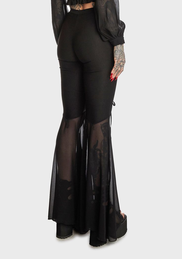 for finding your inner peace. These high-waisted pants have a stretchy double-knit Ponti construction, front cutouts with adjustable lace-up ties, sheer chiffon flared legs, and a side zip closure. Related: Lace-up Pants, Cut-out Bodysuit, Vinyl Bodysuit, Plus Size Pride Clothes, Platform Shoes, Platform Loafers, Rave Boots and Shoes, and Vinyl Clothing. Pants With Cutouts, Black High-waist Party Flares, High Waist Black Flares For Party, High Waist Black Party Flares, Sheer Wide Leg Fitted Pants, Sheer Fitted Wide Leg Pants, Fitted Sheer Wide Leg Pants, Wide Leg Sheer Fitted Pants, Sheer High Waist Party Pants