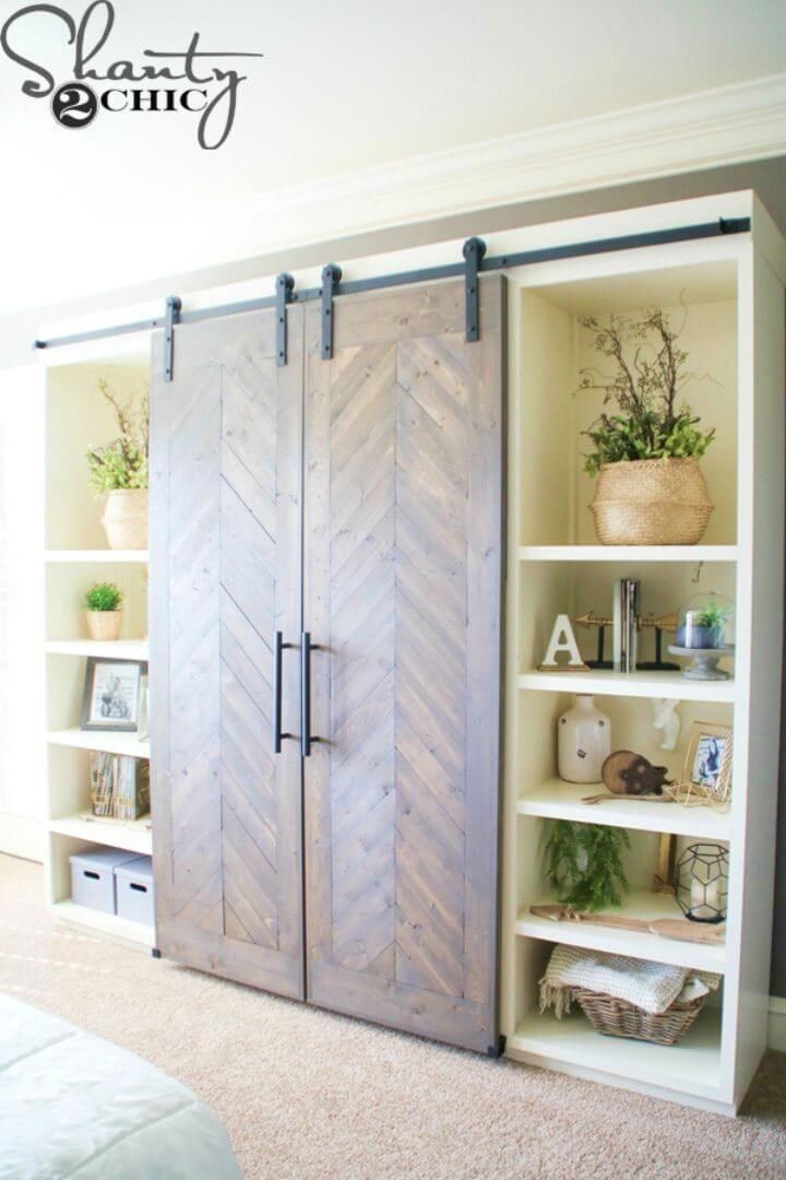 an open bookcase with sliding doors in a bedroom