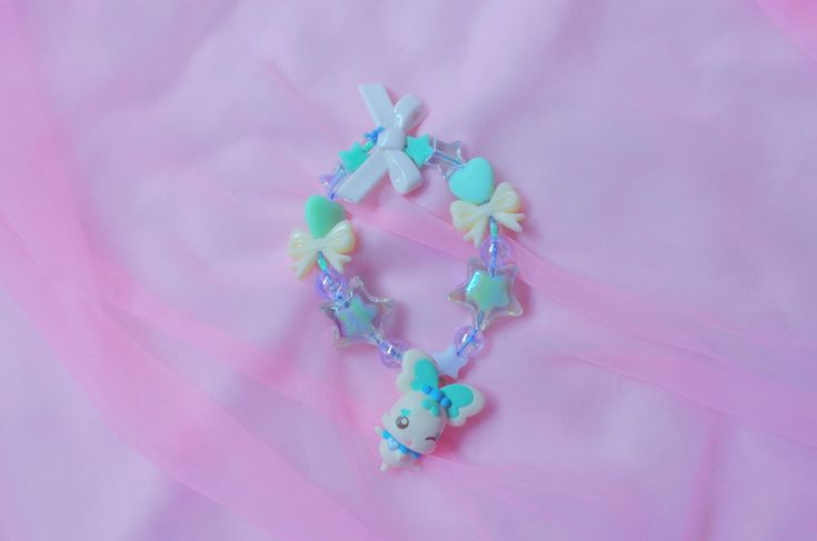 Let everyone see just how magical you are with the cutest coordinate you can dream of!  This is a handmade Heartcatch Precure inspired charm bracelet using an authentic Coffret charm straight from Japan! While this is a new bracelet using new beads and cord, the charm itself is second hand. Please buy knowing there may be some scuffs, chips, and general aging on the charm itself. However, all charms have been disinfected and cleaned to the best of my ability and are happy to serve a new life on Adjustable Jewelry With Cute Design Gift, Handmade Blue Kawaii Jewelry, Cute Blue Charm Bracelet For Gift, Cute Blue Charm Bracelet For Friendship, Kawaii Charms Jewelry For Gift, Cute Charm Bracelets For Gifts, Cute Charm Bracelets As Gifts, Cute Bracelets With Charms As Gifts, Whimsical Jewelry With Cute Design For Gifts